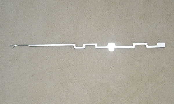 This item is a steel hosiery knitting needle, specifically designed for industrial circular knitting machines.