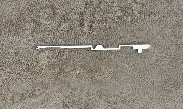 This item is a steel circular knitting machine needle used in textile industries for hosiery manufacturing.