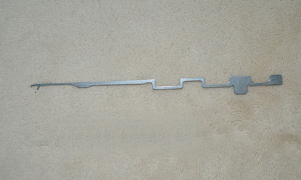 This item is a circular knitting machine needle, specifically designed for use in textile manufacturing machinery.