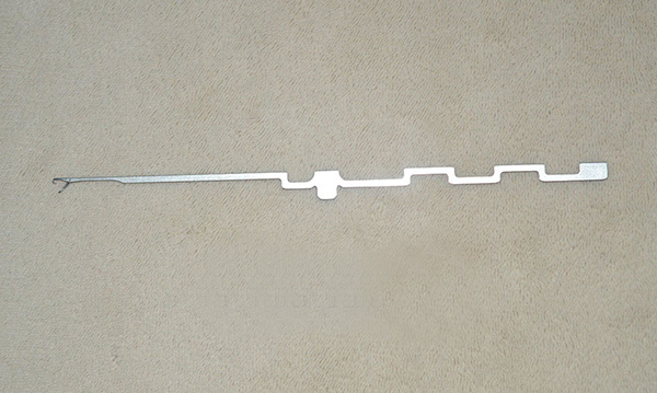 This item is a steel hosiery knitting machine needle, often used in circular or flat knitting machines for producing fabrics.