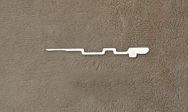 This item is a steel circular knitting machine needle, likely a model such as the VO 65.61 or 104.41, used in hosiery and textile production.