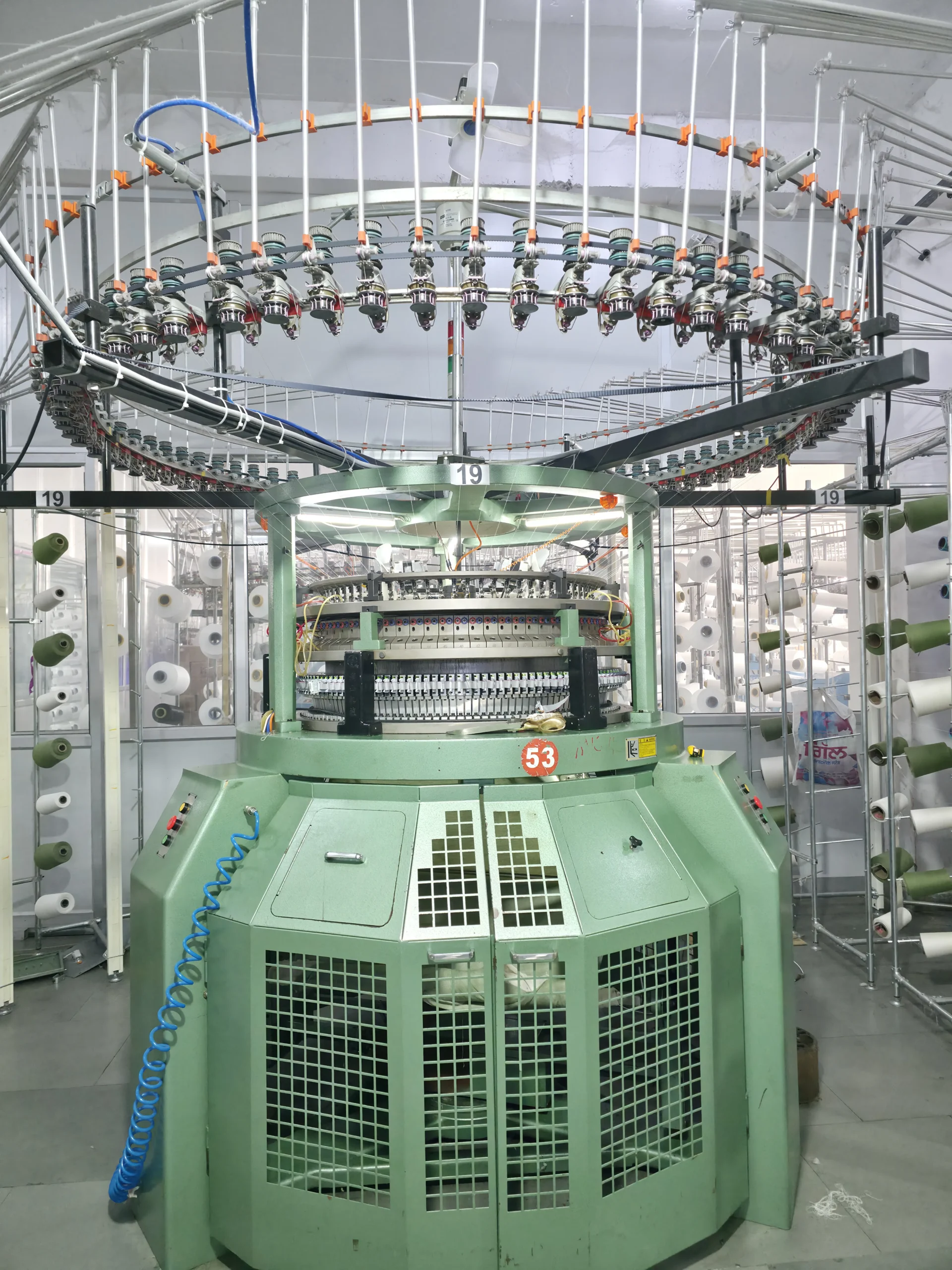 Industrial fabric knitting machine close shot